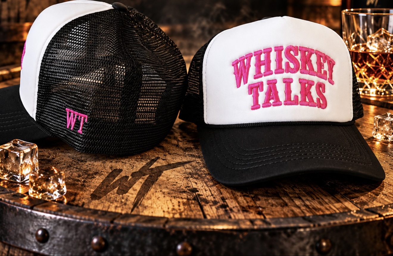 Whiskey Talks trucker hat with pink embroidery